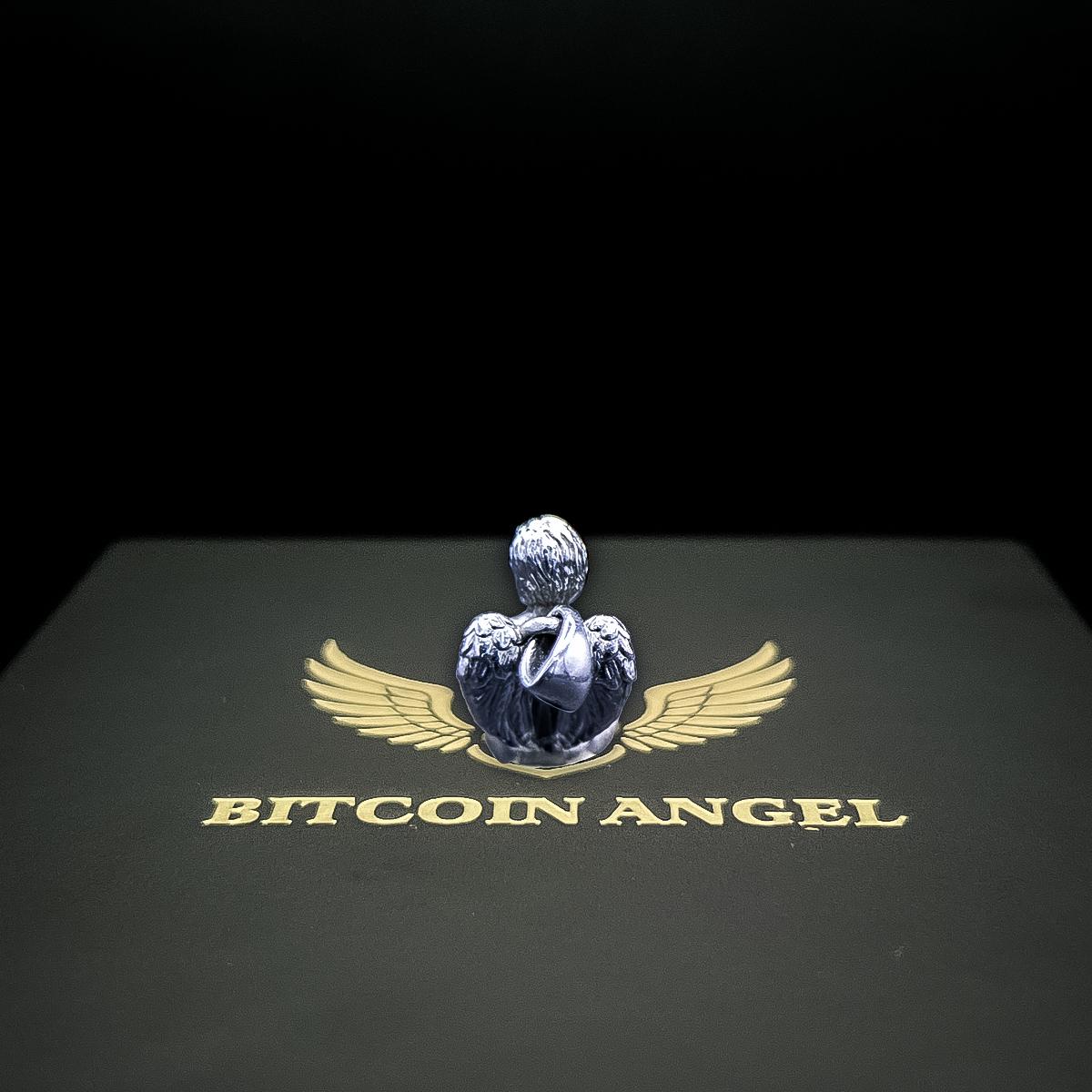 Statue of an angel with wings and 'Bitcoin Angel' text on a black background