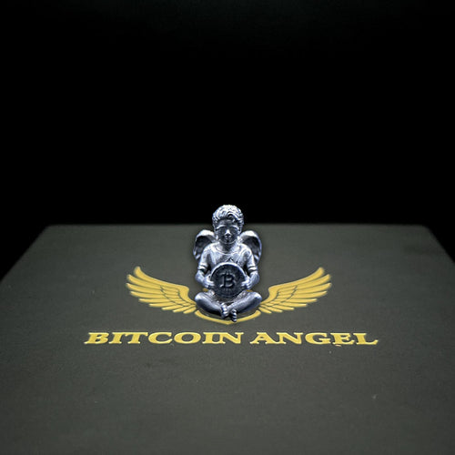 Metallic angel figurine with wings holding a Bitcoin symbol on a black background with 'Bitcoin Angel' text.